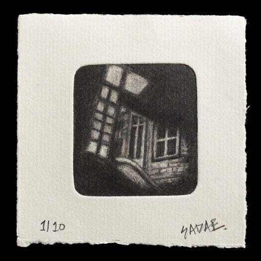 The print "Lost" by Sadaf Mirza showcases a somber scene, rendered in dark tones with subtle hints of light. The composition features a window with two panes on either side of a central pillar, set against a backdrop of black walls and a floor that recedes into the shadows.