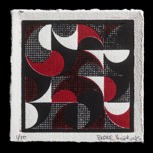 This print, titled "Swirl Geometrics" by Blake Hopkins, showcases a unique blend of techniques. Executed using relief print, woodcut, and laser-cut methods, the artwork features intricate geometric patterns in red, white, black, and gray hues. The bold contrast between these colors creates a striking visual effect, while the textured paper adds depth to the overall composition.