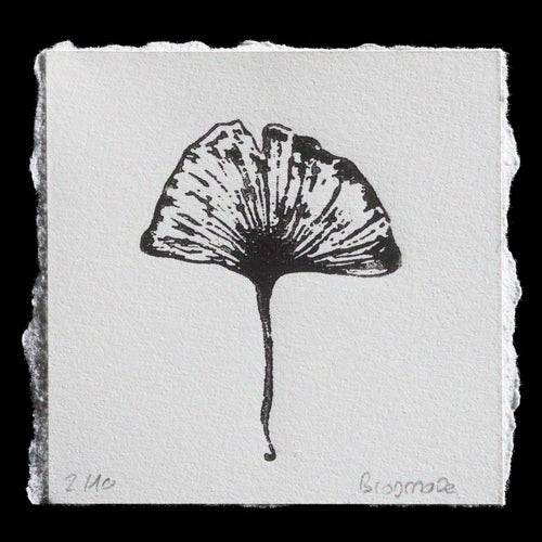 This striking black-and-white print, titled 'Leaf Me Be' by Biosmose, showcases a detailed ginkgo leaf rendered in wood engraving and lasercut techniques. The monochromatic palette features bold lines that accentuate the intricate details of the leaf's veins and edges against a stark white background.