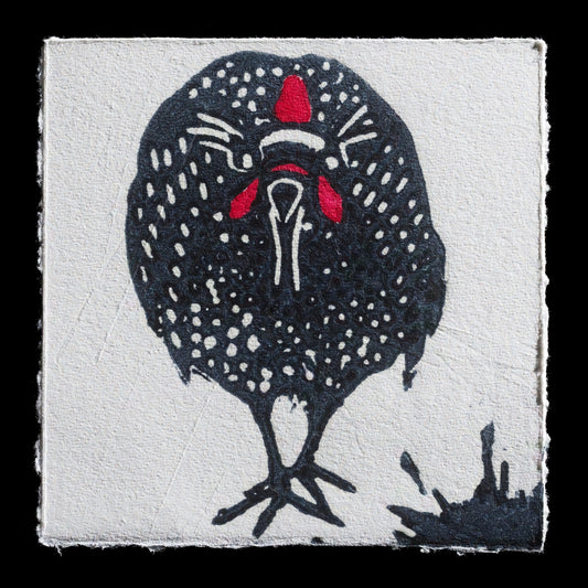This artwork, titled 'Guinea fowl' by Isabelle Waxin-Denneulin, is a captivating linocut print that showcases a watercolor technique. The striking black background provides a dramatic contrast to the vibrant red accents on the bird's head and feet, while its dark plumage features white spots scattered across it.