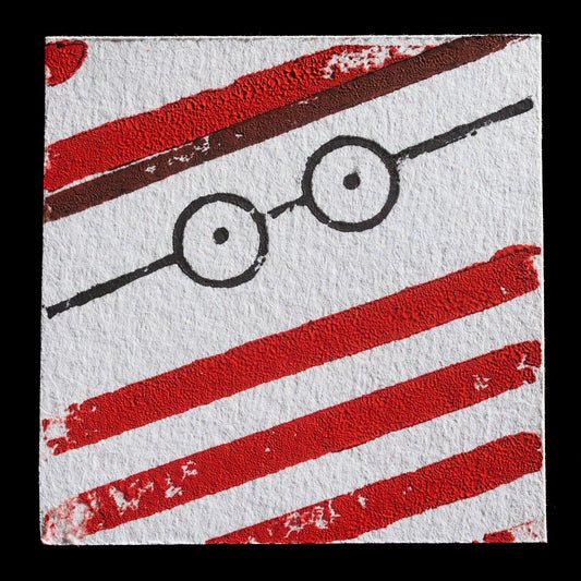 The artwork "Found him!" by Felix Nienaber is a print created using woodcut, wood engraving, and lasercut techniques.

**Key Features:**

* Two eyes with black pupils and white irises
* Red lines crisscrossing the background
* Distinctive red circles at top left and bottom right corners