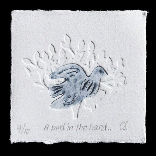 This print, 'A bird in the hand...', by Corinna Spencer, showcases a bird design with blind embossing on Tetra Pak paper using intaglio techniques. The artwork features black ink on white paper with subtle blue undertones.