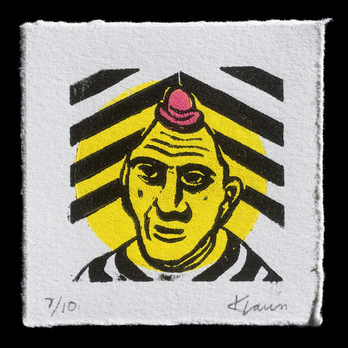 This linocut print by Karl Laun presents a striking image of a man's head and shoulders set against a white background. A pink hat adorns his head, while black lines radiate from it in all directions. The artist has incorporated yellow paint into the design, which is also applied to the pink hat, creating a visually appealing contrast.