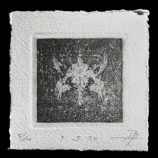 This etching print, untitled by Andreas Joska-Sutanto, features a striking monochrome composition with a central dark square surrounded by a lighter border. The print's background is characterized by subtle texture and intricate details that add depth to its overall aesthetic.