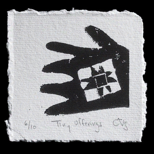 This captivating linocut print by Claire Voelkel-Sedlmeir is titled "Tiny Offerings." The artwork features a striking black handprint holding a small cube with intricate white geometric patterns, set against a plain off-white background. The artist's use of bold contrasts and precise cuts creates a visually appealing piece that invites the viewer to contemplate the significance of these "tiny offerings."