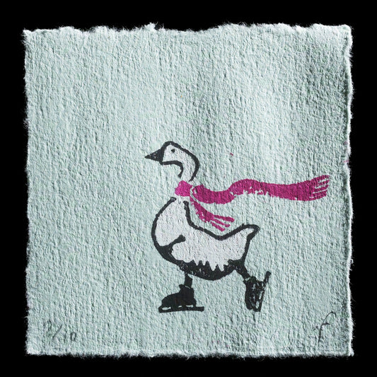 This captivating linocut print, "The Skater," showcases a charming scene by Ramona Fontaine. At its center is an ice skater wearing a pink scarf, depicted in bold black and white hues with striking magenta accents. The artist's use of contrasting colors adds depth to the image, creating a visually appealing representation of the skater in motion.