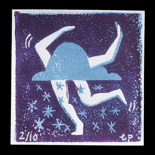 This linocut print, titled "Snow Dance" by Emilie Proulx, features a stylized figure in motion against a deep blue background adorned with light blue stars. The artist's use of contrasting colors creates a striking visual effect, capturing the essence of winter and movement.