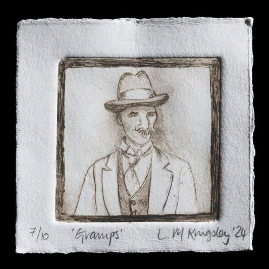 The "Gramps" print by Lesley M Kingsley showcases a detailed etching featuring a man with a distinctive moustache, dressed in formal attire including a suit jacket and tie, set against a plain background. The artist's use of watercolor adds delicate touches to the piece. This print is a testament to Kingsley's skill in intaglio technique, resulting in a richly detailed work that invites close examination.
