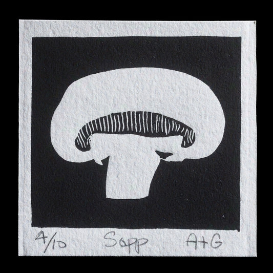 This linocut print by Diego Aguilera showcases a stylized mushroom in black ink on white paper. The mushroom's cap features bold, striped lines that contrast with its smooth body. A simple border frames the image, with a handwritten note at the bottom identifying the subject as 'Sopp'.