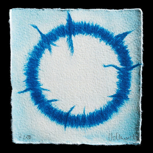 This print, titled 'Rund' by Jutta Vollmer, showcases a striking blue circle with vibrant brushstrokes radiating from its center, rendered in drypoint technique on paper. The artist's use of bold color and dynamic lines creates a captivating visual effect, inviting the viewer to explore the intricate details within the circular composition.