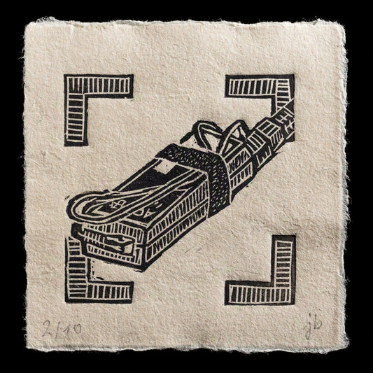 This print, titled "Power supply" by Juraj B�n�, is a captivating linocut artwork that showcases intricate details and textures. The composition features a stylized power supply unit in black against a light-brown background, evoking a sense of industrial machinery. The artist's use of bold lines and geometric shapes creates a striking visual effect.