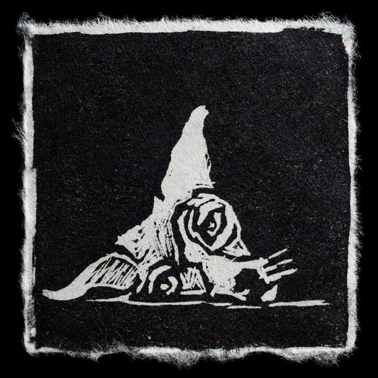 This print, titled "Alfie" by Dana Mero, showcases a striking black and white relief print featuring a stylized rose design in stark white against a solid black background. The artist's bold use of contrast creates a visually striking image that draws the viewer's attention to the intricate details of the rose.