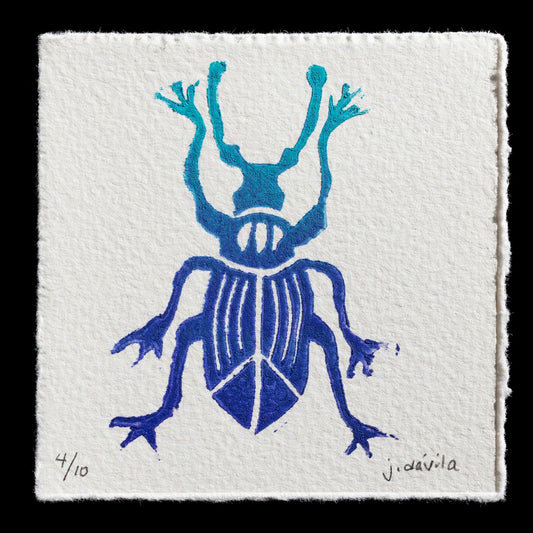 This relief print, titled "Specimen IV" by Jane Davila, features a blue beetle with six legs and two antennae on a white background. The print showcases the artist's use of bold colors and intricate details in relief printing technique.