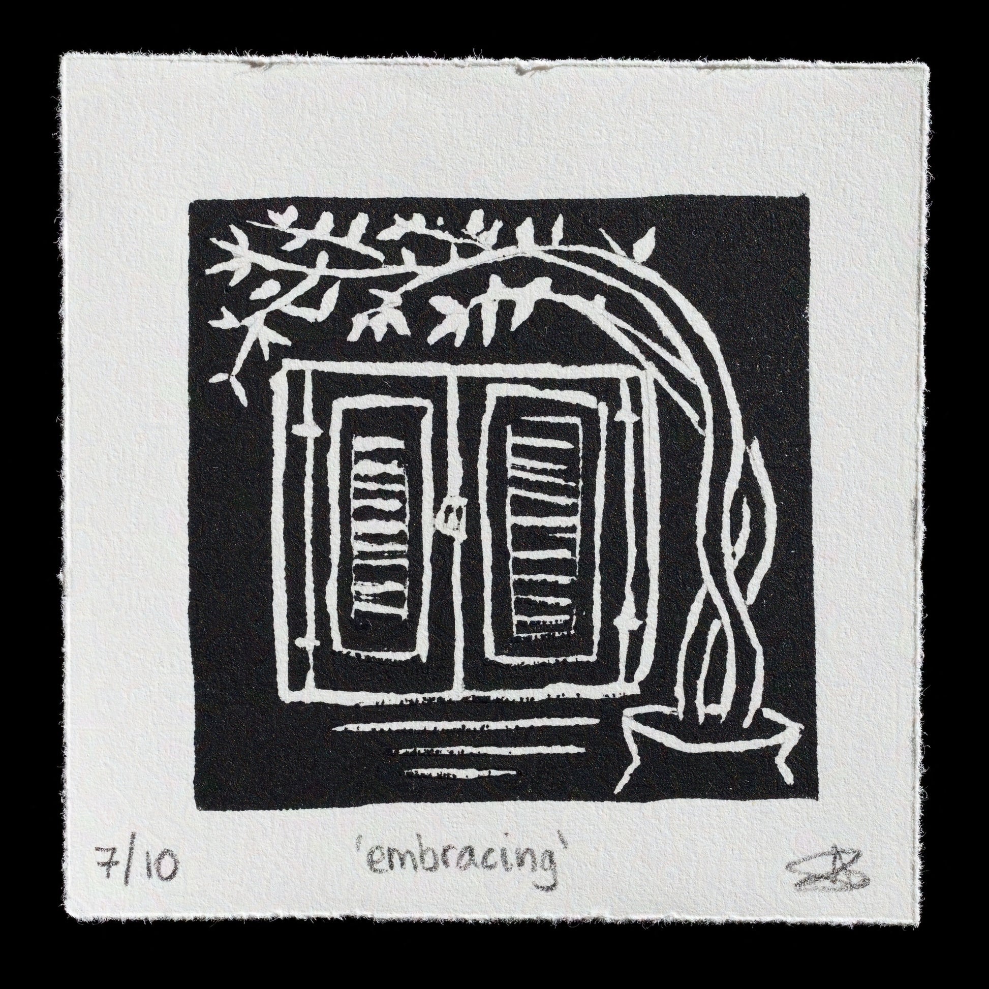 This print, titled "Embracing" by Antigoni Vlachou, features a striking black-and-white linocut technique. The composition showcases a window with open shutters, surrounded by lush greenery, creating an inviting and serene atmosphere.