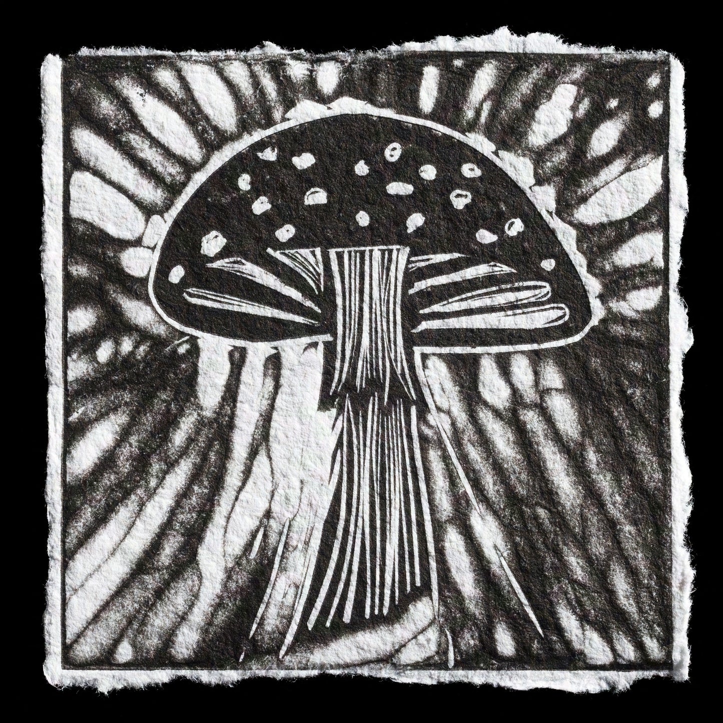 This striking black-and-white linocut print showcases a detailed mushroom against an abstract background.

The print features bold lines and geometric shapes, with the mushroom's cap taking center stage. The artist's use of negative space creates a visually appealing contrast between light and dark areas. The overall effect is one of simplicity and elegance, making this print a captivating addition to any wall.