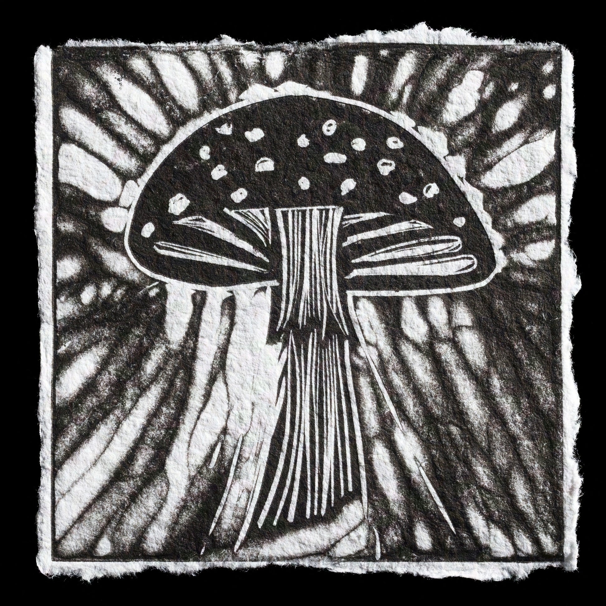 This striking black-and-white linocut print showcases a detailed mushroom against an abstract background.

The print features bold lines and geometric shapes, with the mushroom's cap taking center stage. The artist's use of negative space creates a visually appealing contrast between light and dark areas. The overall effect is one of simplicity and elegance, making this print a captivating addition to any wall.