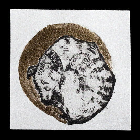 This monochrome print, "Sleeping Beauty" by Maureen Da Silva, features a serene sleeping figure within a circular frame, surrounded by gold glitter.
