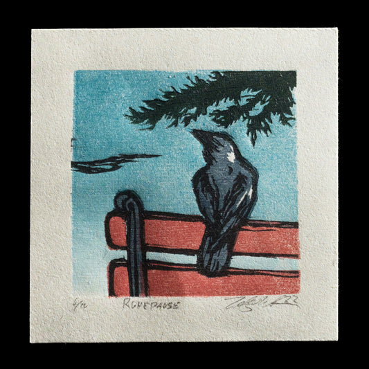 This woodcut print by Toby M. Schreier depicts a bird perched on a red bench, surrounded by blue sky and greenery. The title 'Ruhepause' translates to "rest" or "relaxation."