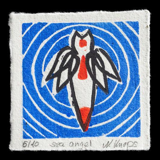 This linocut print, 'Sea Angel' by Nicole Knops, features a stylized sea angel in white with red accents, set against a blue background. The abstract design showcases a unique blend of shapes and colors, characteristic of Knops' work.