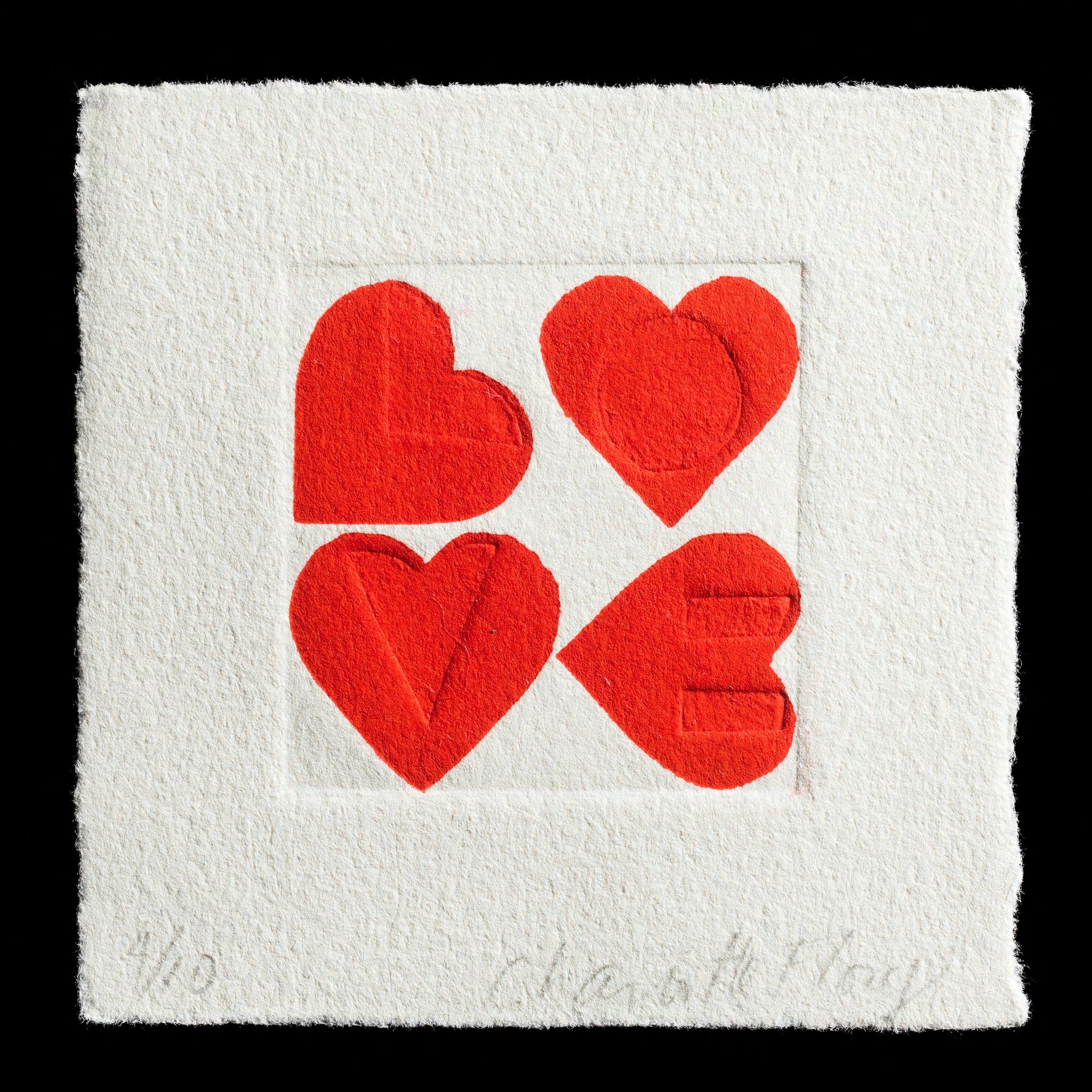 The image features a square piece of artwork with a white background, showcasing four red hearts arranged in a square formation. The artist's name, 'Charlotte Flory', is subtly inscribed at the bottom of the artwork in grey letters. This unique print combines relief printing techniques with blind embossing to create a visually striking and tactile experience.