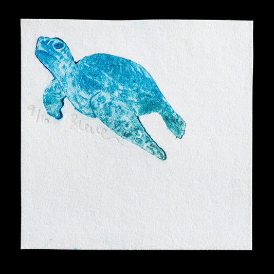 The artwork titled "Turtle" by Bonnie Laverock is a captivating piece created using intaglio and drypoint techniques on TetraPak material. This striking blue print features an abstract turtle motif, showcasing the artist's unique approach to traditional printing methods.