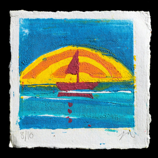 This vibrant print, "Mordros" by Jenn Rose, showcases a striking linocut technique. Against a bold blue background, a dark red sailboat glides across the water, its sails billowing in shades of yellow, orange, and pink against an arched rainbow-hued sky. The artist's signature is discreetly placed at the bottom right corner, while the print's edges are neatly torn.