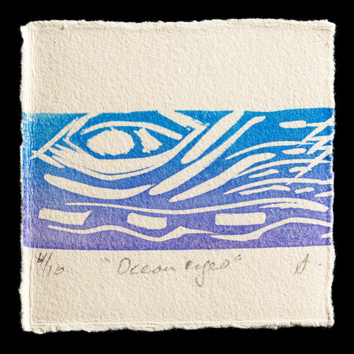 This print, titled 'Ocean Eyes' by Amanda Cruise, showcases a captivating linocut design with blue hues. The artwork features stylized waves that evoke an oceanic theme, set against a cream-colored background. A subtle signature at the bottom adds a touch of authenticity to this beautiful piece.