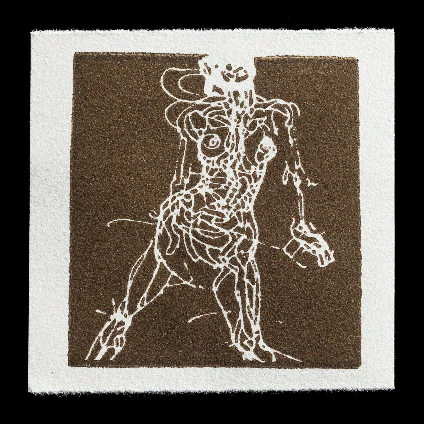 This linocut and laser-cut print by Krrrl presents a striking abstract figure set against a brown background. The white outline of the figure's body is defined by bold lines, with its right arm raised and left leg bent at the knee. The overall composition exudes an air of tension, as if frozen in mid-motion.