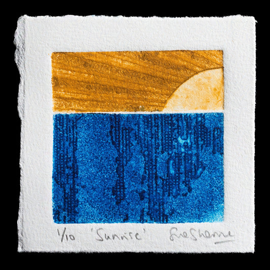 The artwork, 'Sunrise' by Sue Sherman, is a captivating piece that employs the technique of collagraph to create a stunning visual effect.

**Key Features:**

* The composition showcases a harmonious blend of warm orange hues at the top and deep blue tones below.
* A subtle transition from light to dark creates a sense of depth and dimensionality.