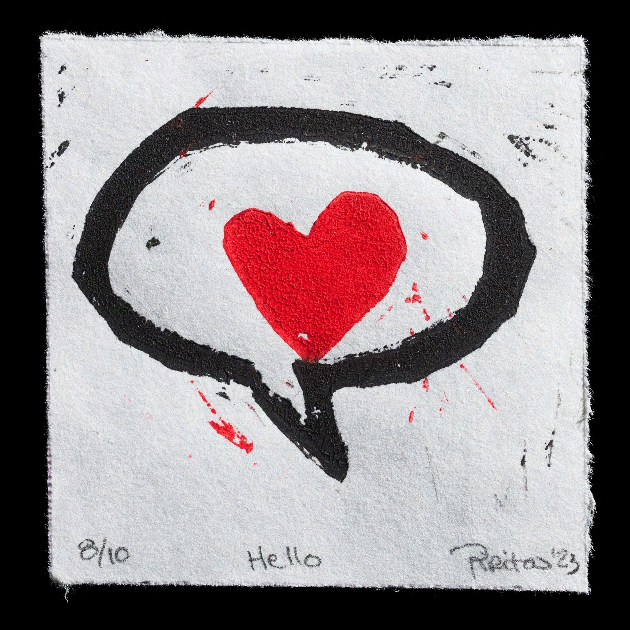 This print, titled 'Hello' by Pirita Paananen, showcases a striking design featuring a black speech bubble with a red heart at its center, set against a white background. The linocut technique is evident in the bold lines and textures of the print.