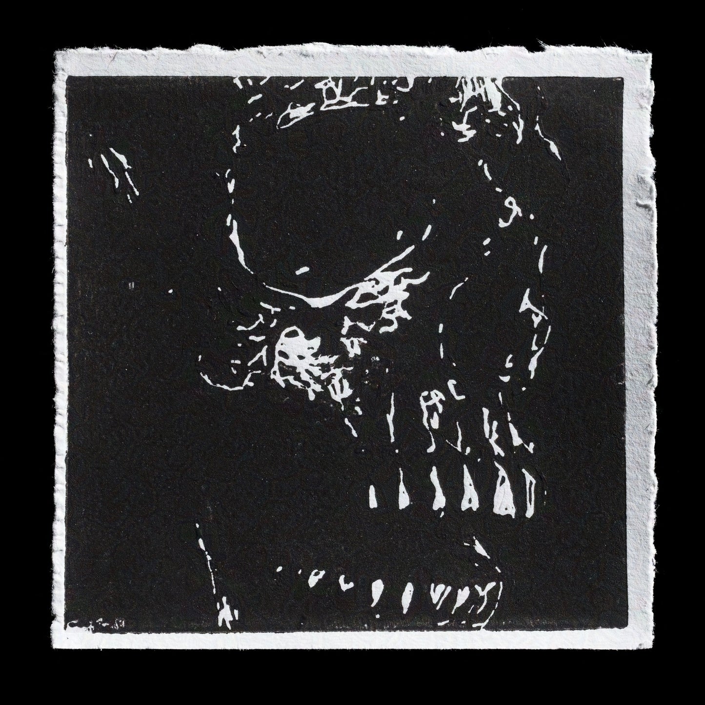 This monochromatic linocut print features a skull with a subtle smirk, rendered in white against a black background. The artist's name is discreetly integrated into the design. The image presents a striking contrast between light and dark, creating a visually captivating effect.