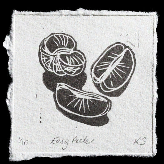 This captivating linocut print, titled "Easy Peeler" by Kitty Stogdon, showcases a striking arrangement of three citrus fruits against a crisp white background. The vibrant orange hue adds warmth to the composition, while the artist's signature in pencil at the bottom provides a subtle yet elegant touch.