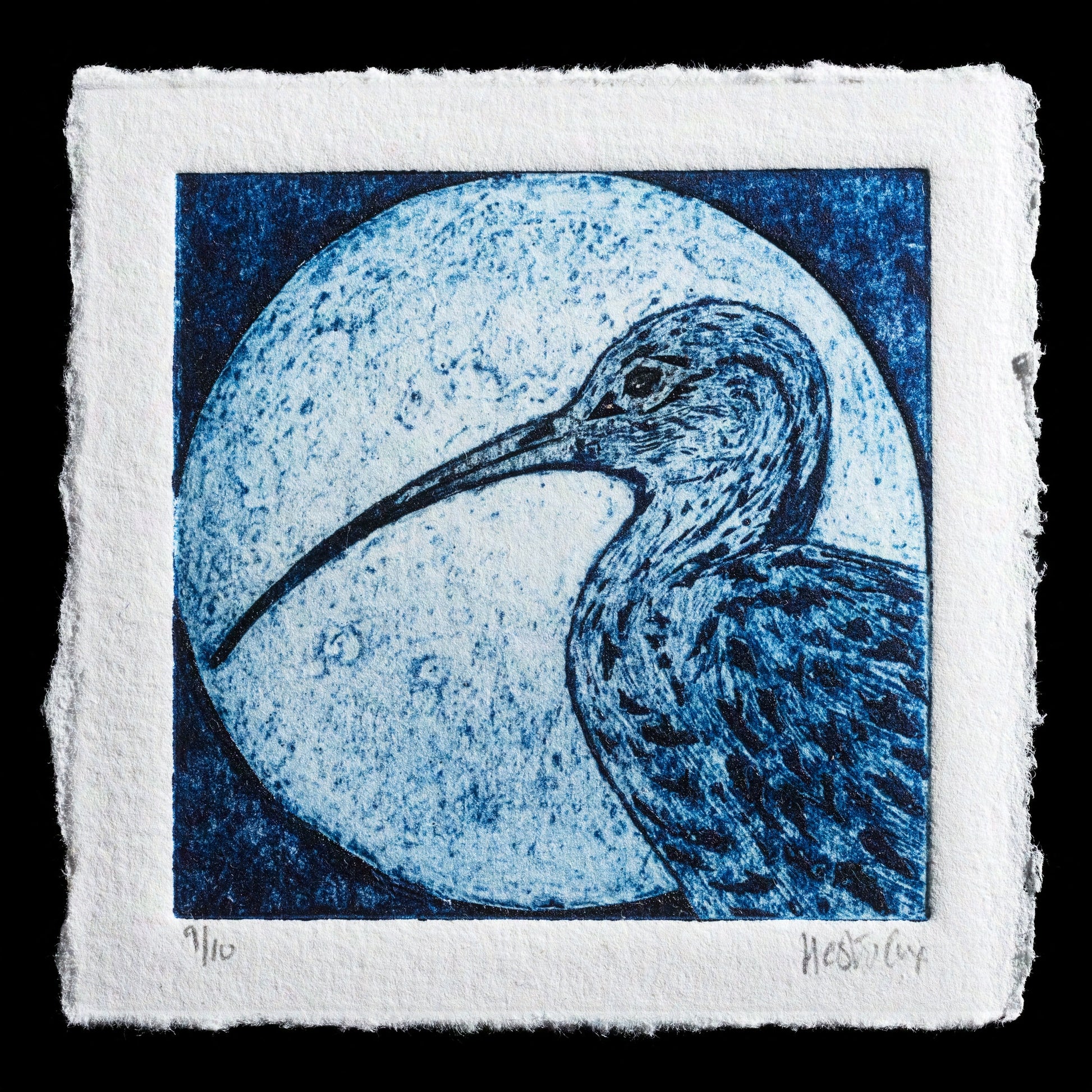 The 'Curlew Moon' print by Hester Cox showcases an intaglio and collagraph technique, featuring a serene blue-hued moon with a curlew bird in the foreground against a black background. The print's intricate details and subtle color palette create a captivating visual effect.