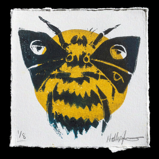 This linocut print, "Find It" by Hollyn Johnson, features a striking black moth with yellow highlights set against a solid background. The artist's use of bold lines and vibrant color creates a visually captivating piece that showcases their skill in linocut techniques.