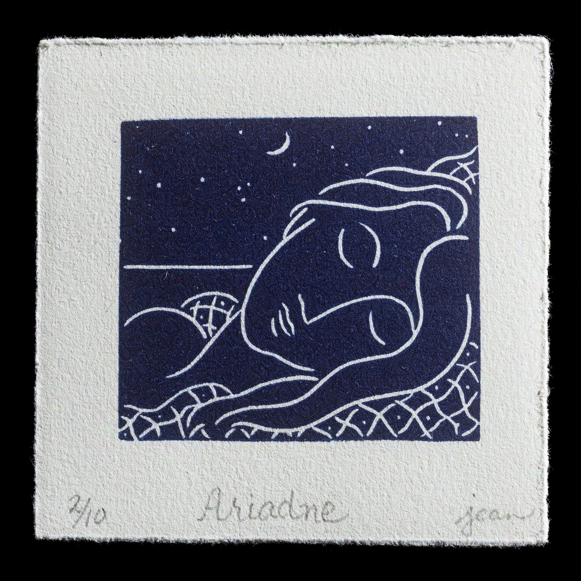 This linocut print, titled "Ariadne" by Jean Capron, features a serene scene with a sleeping woman in a dreamlike state, set against a starry night sky. The dark blue hue of the background is punctuated by white stars and a crescent moon, while the woman's body is depicted in a gentle, flowing pose.