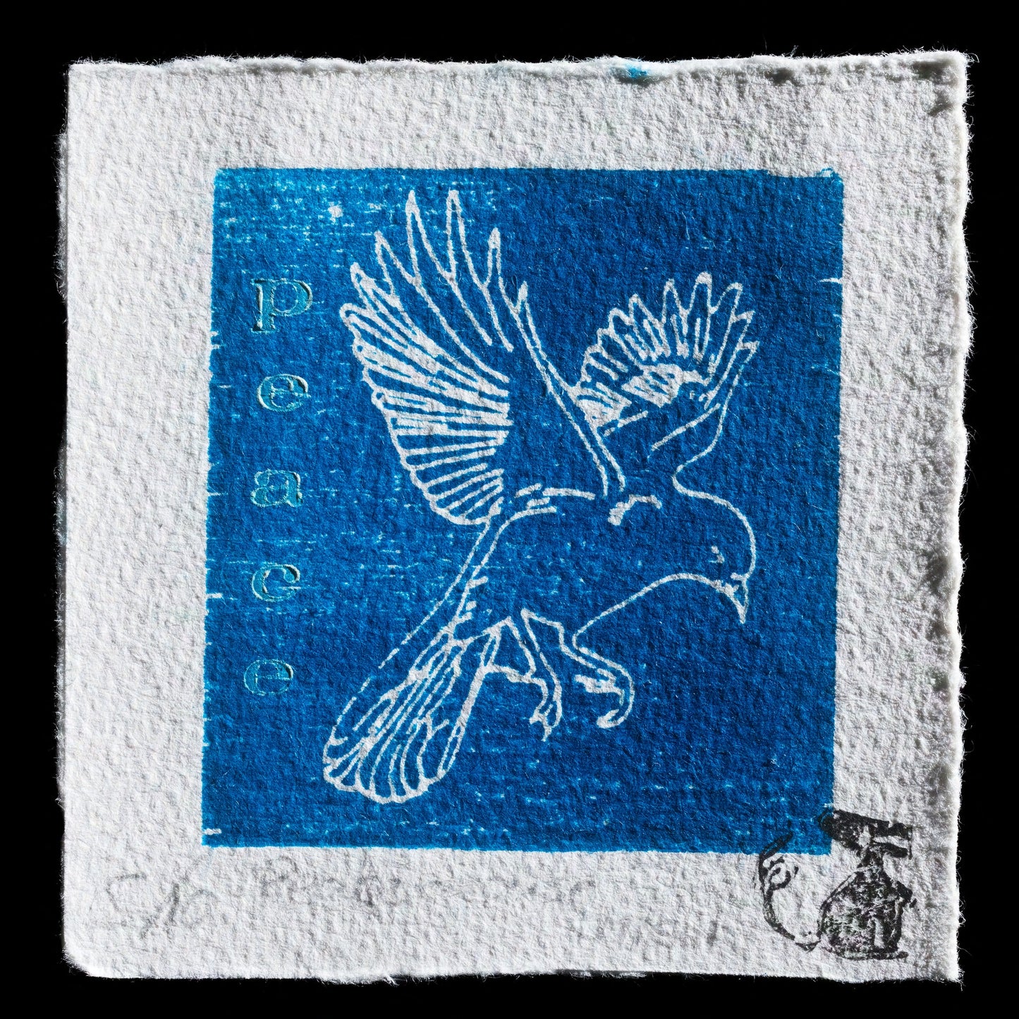 The image depicts a blue square with a white dove in flight, surrounded by the word "Peace" inscribed vertically along its left side. Below the blue square is an engraved image of a grenade.

This artwork is titled 'Peace mousse' and features linocut and wood engraving techniques.