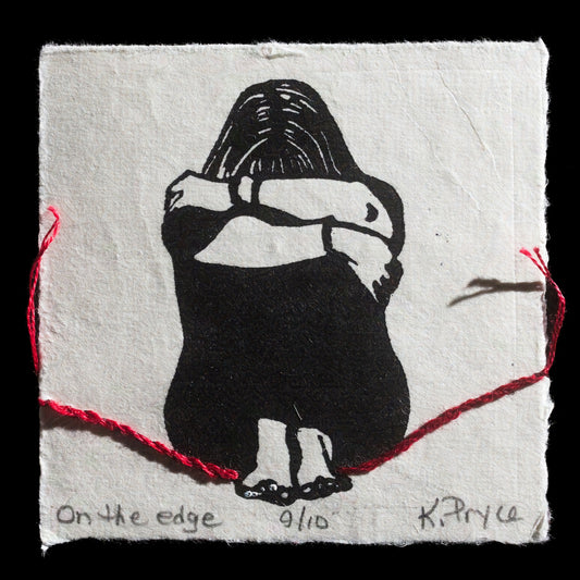 The artwork "On the Edge" by Kathryn Pryce showcases a black-and-white linocut figure with red thread intricately woven through it, adding texture to this mixed-media piece.