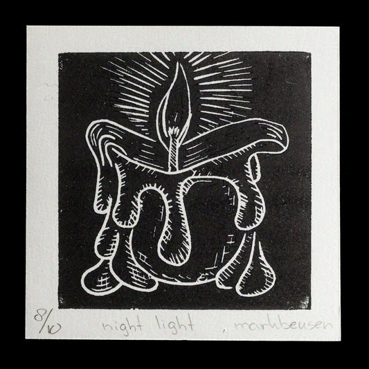 This wood-engraved print, titled "Night Light" by Mark Beusen, showcases a striking candlelit design in black ink on white paper. The central flame is surrounded by a stylized candle base, set against a solid black background. A crisp white border frames the artwork, providing a clean and elegant presentation.