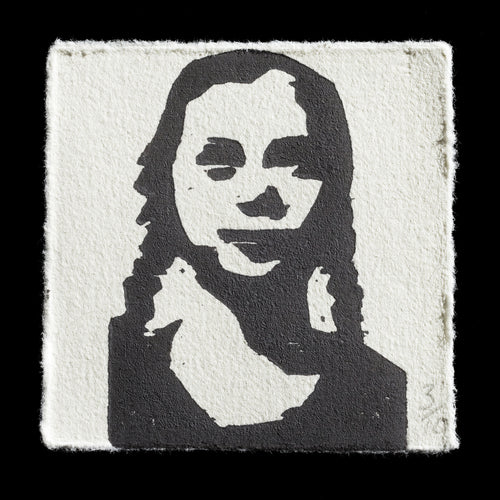 This print features a black-and-white woodcut portrait of Greta Thunberg by artist Jan Krummrey. The piece showcases the climate activist in a simple yet striking composition, with bold lines and minimal coloration. The wooden grain texture is visible throughout the print, adding depth to the monochromatic design.