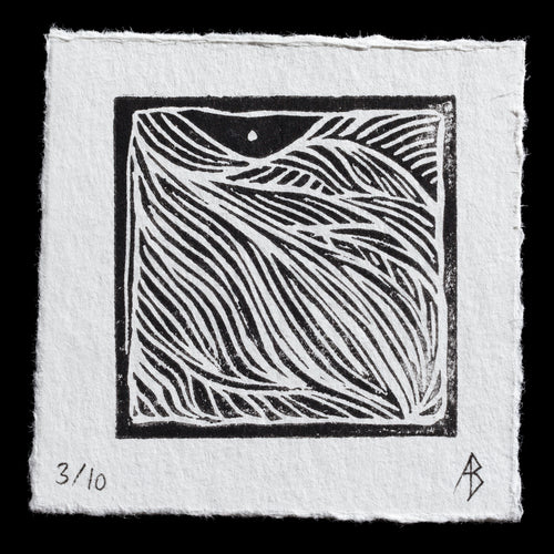 This linocut print, titled 'Folds' by Barbara Sedderz, features a serene landscape with gentle folds in the terrain. The black-and-white artwork showcases a mountainous scene with subtle shadows and highlights, created using the traditional techniques of linocutting to achieve intricate details and textures.